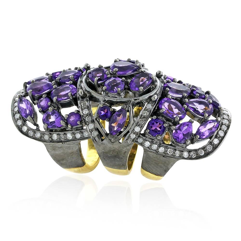 Mosaic designed Amethyst and Diamond Knuckle Ring, this ring is very comfortable and has three  rings on the back to give it easy to wear.

18k:4.94g
Dimaond: 0.87ct
Silver:14.7gm
Amethyst:8.07ct