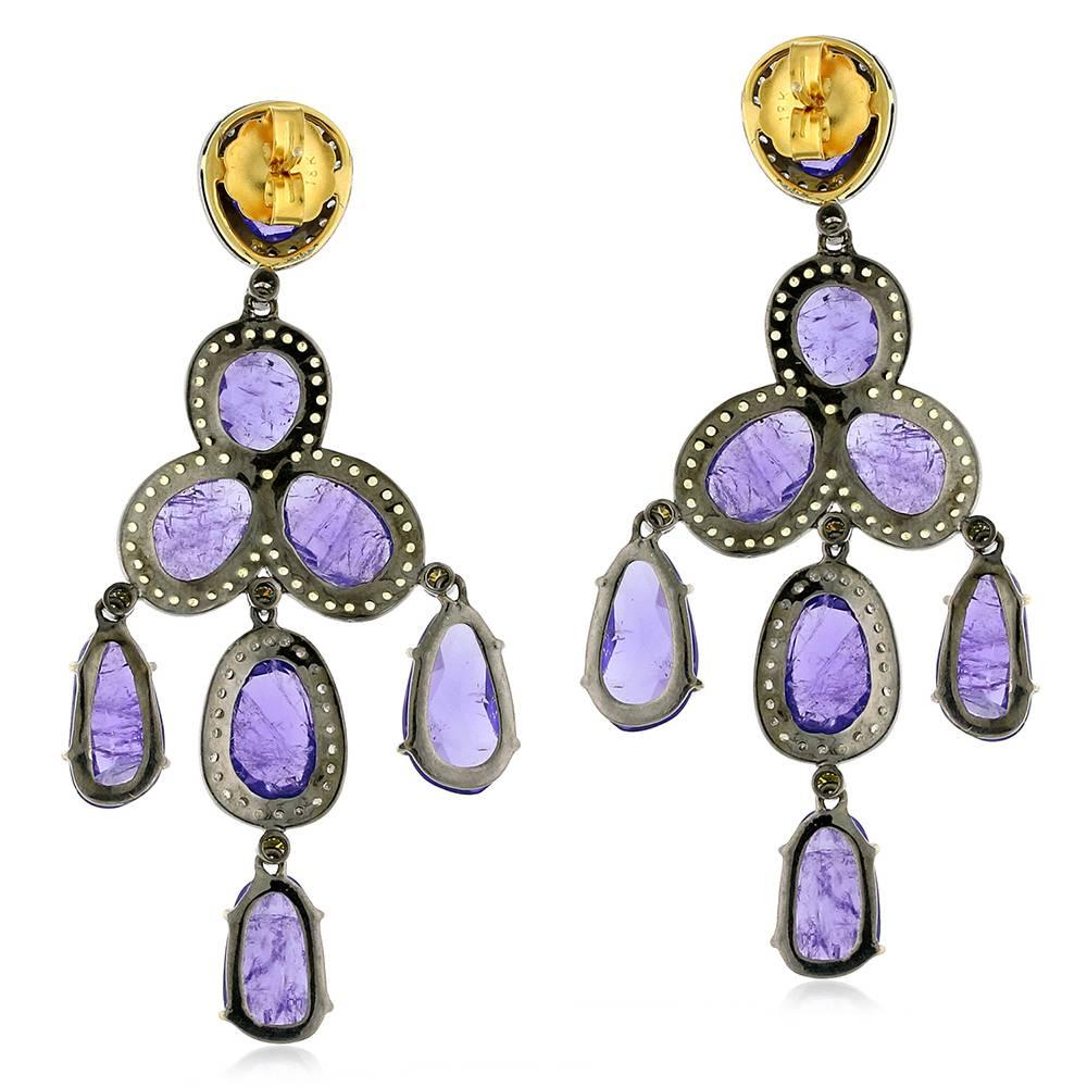 Simple and sleek Oval Tanzanite Chandelier earring with pave diamonds and yellow sapphire around.

Closure: Push Post

18kt:5.09gms
Diamond: 1.38cts
Silver: 8.08gms
Yellow Sapphire:1.63ct
Tanzanite:43.60ct