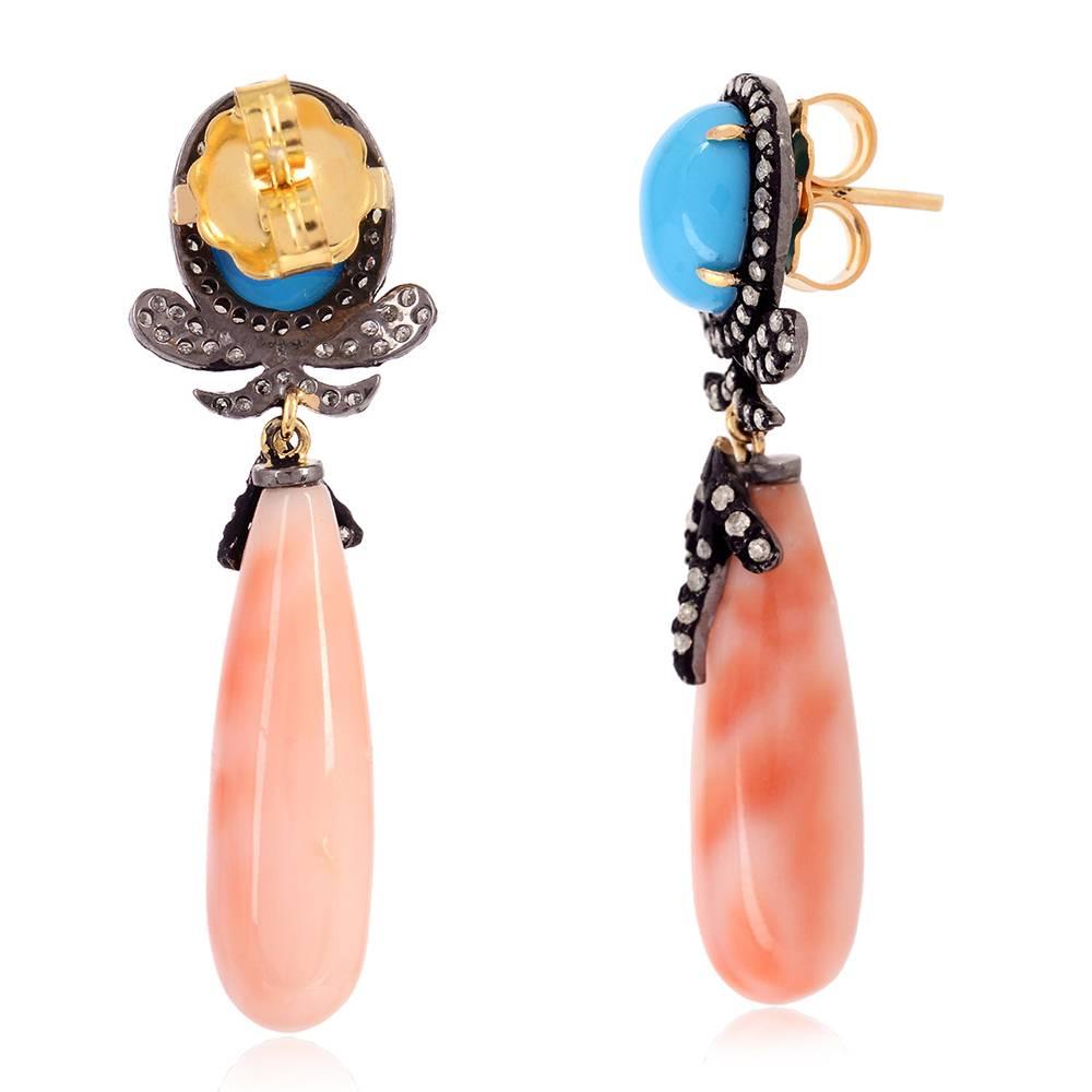 Let these be your favorite earrings this summer with drop shape coral bead and turquoise on top and diamonds around making it a very chic earring.

Closure: Push Post

18kt:1.7gms
Diamond: 0.75cts
Silver: 2.154gms
CORAL: 25.93cts
TURQUOISE 4.9cts

