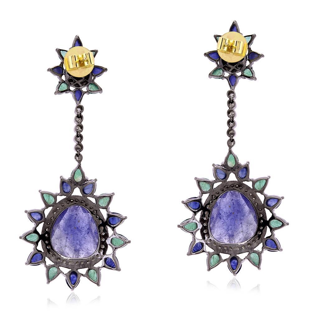 Stunning and sleek Tanzanite Blue Sapphire Emerald Earring with Diamond accent is a pefect earring to pair with your summer look.

Closure: Push Post 

18kt:1.62gms
Diamond: 1.535cts,
Slv:13.38gms
Emerald: 4.88cts
Blue Sapphire: 9.05cts
Tanzanite: