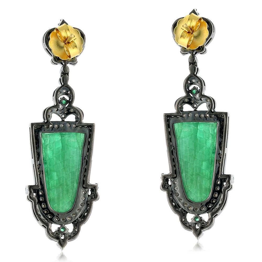 Royal looking carved emerald earring with diamonds around is subtle and every green designer piece. 

Closure: Push Post

18k:1.47g
Diamond: 3.04ct
Slv:12.89gm
Emerald:27.2ct
