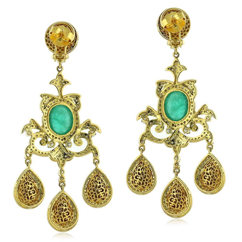 This amazingly gorgeous Victorian Looking Emerald & Diamond Chandelier Earring in Gold & Silver is our one of our favorite piece. Wear it at your special occasions. 
Closure: Omega with Push and Post

14k: 14.33g
Diamond: 7.74ct
Slv: