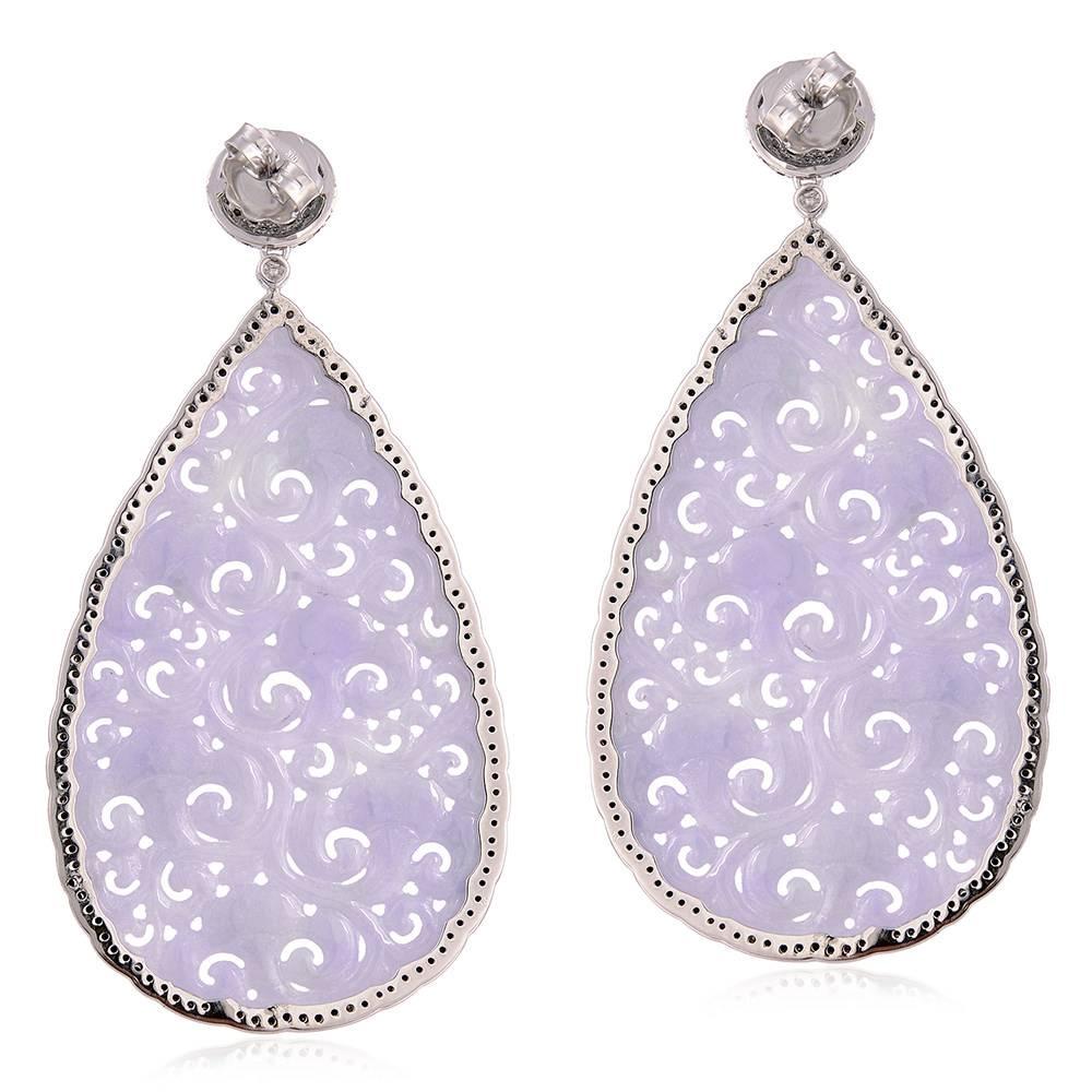 Long and classy very finely carved Lavender Jade earring with black diamonds around and a black diamond dome stud on top with push and post to wear, this is a beauty forever.

18kt: 13.234 gms
Diamond: 2.93 cts
Jade: 88.66cts