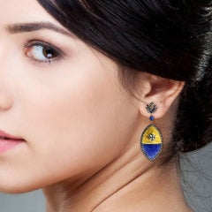 Carved Tanzanite Earring in Gold and Silver with Diamonds