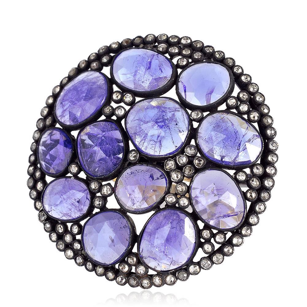 This round ring is a sassy cocktail ring with flat cut bezel set Tanzanite and Diamonds perfect to make a statement.

Ring Size: 7 ( can be sized )

14kt:1.56gms
Diamond: 1.59cts
Slv:4.56gms
Tanzanite: 16.18ct