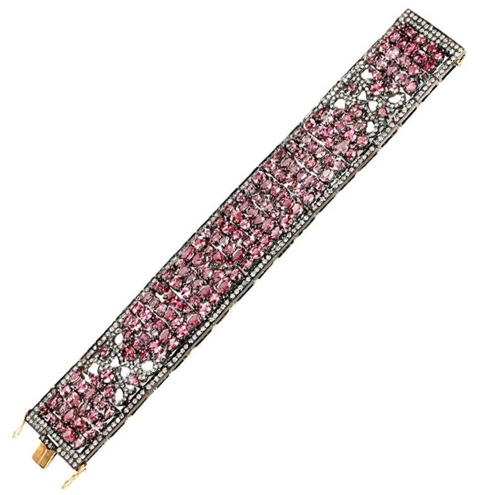 This Pretty Pink Tourmaline Bracelet with Diamonds is very well set in a mosaic style. This bracelet when closed hugs the hand and sits very well on hand with tongue clasp and safety locks on both the sides.

18k:11.32g
Diamond: 5.7ct
Tourmaline:
