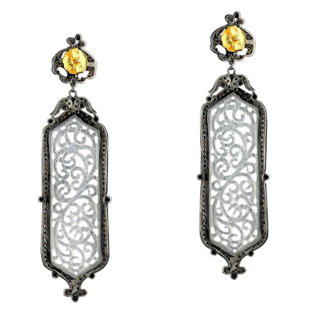 Long and lovely White Carved Jade Earring is a super apt for a snowy Christmas party a beach wedding or a date night with you hair tied up.

Closure: Push Post

18k: 1.5g
Diamond: 3.16ct
Slv: 19.31gm
Sapphire: 2.75ct,
Jade:47.40 cts