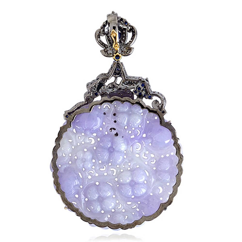 Beautiful Round Lavender Jade Pendant with Diamonds and Sapphire design around, This pendant doesn't come with any chain and has an openable bayle at the back.

18KT: 1.51G
Diamond: 1.59CT
SL:14.13G
BLUE SAPPHIRE: 2.54CT
JADE:121.15Ct