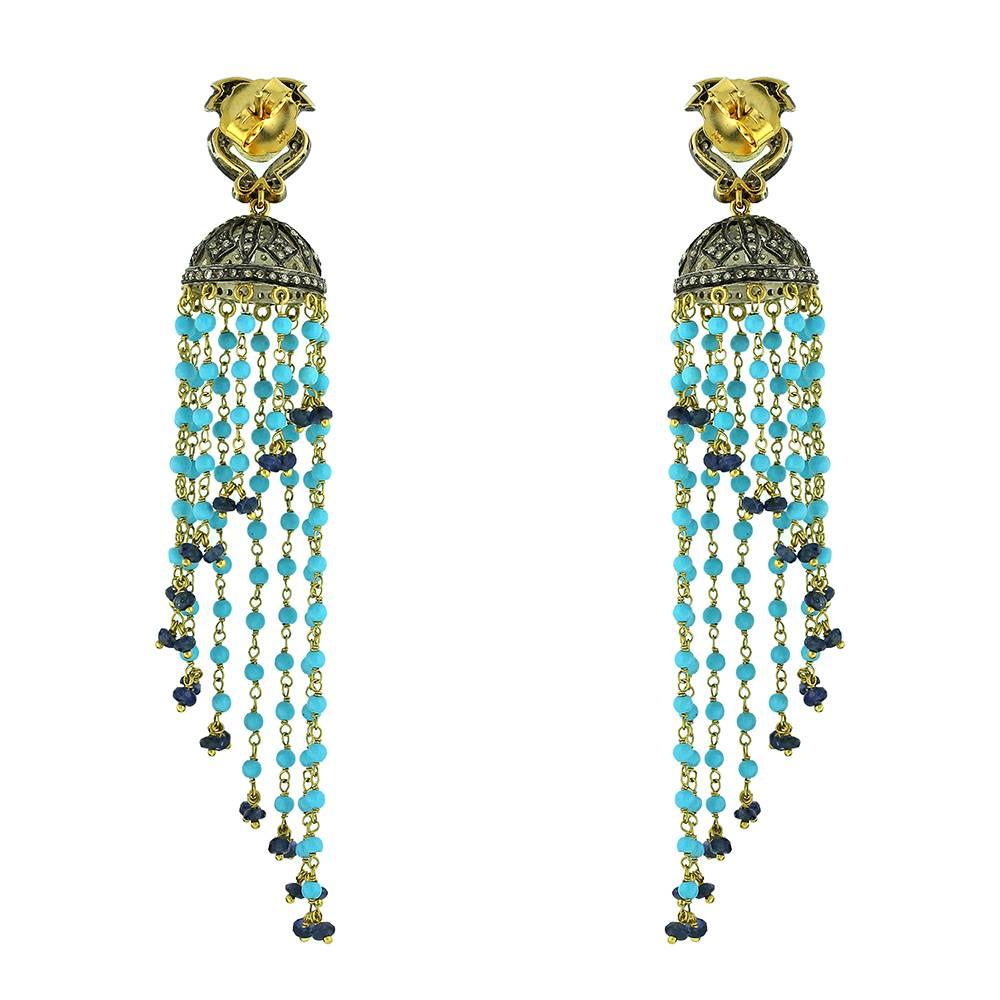 Very Vintage and artsy looking Diamond and Turquoise Tassel Earrings. You can rock this classic looking earring with you denim, short black or any boho dress. 

Closure: Push Post

14k: 7.22 gms
Diamond: 1.11 cts
Tourquiose: 18.99 cts

