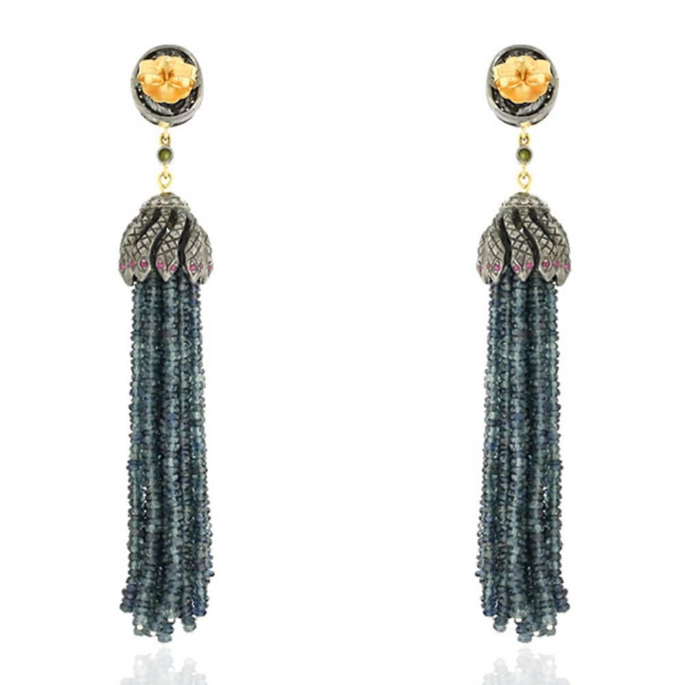 Antique looking best to go with boho look this blue sapphire tassel earring with snake charmer cap with sapphire and pave diamond stud on top will be stunning.

Closure: Push Post

18k: 2.38g
Diamond: 0.78ct
Ruby- 0.37ct
Sapphire- 142.63cts
