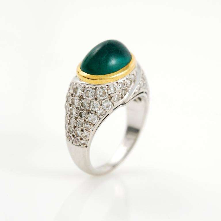 18kt yellow and white gold ring, featuring diamonds and an emerald cabochon.
1980's, size 7.