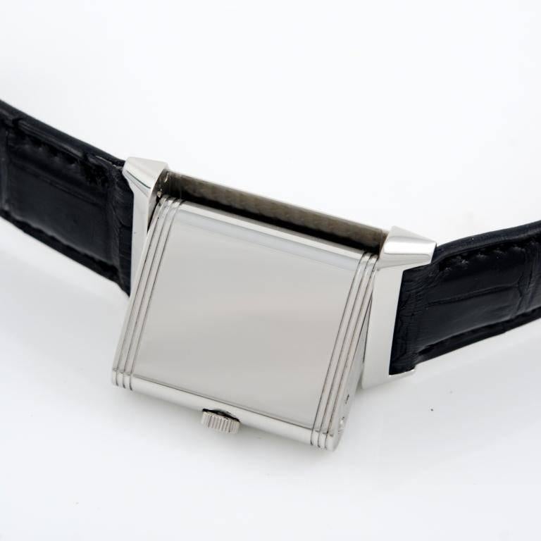 Stainless steel Jaeger LeCoultre Reverso Grande Taille, ref.270.8.62, 1990s. 
Silvered dial with Arabic numerals and baton hands. Manual-wind movement. Leather strap with stainless steel Jeager LeCoultre buckle. 
The watch comes with original