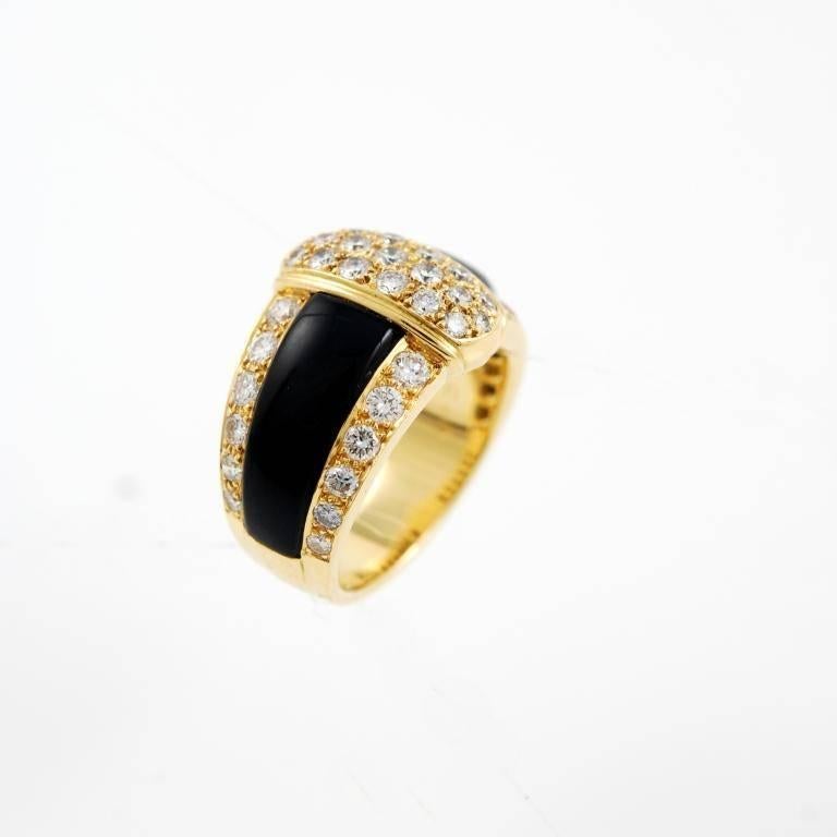 18kt yellow gold, diamond and onyx Van Cleef & Arpels band ring, 1980'S.
The inside is stamped 