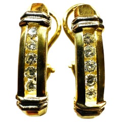 Boucles d'oreilles en or jaune et blanc 14k avec diamants .30 carats Omega