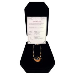 Collier-broche Erte en or 14 carats et argent sterling, avec diamant de 0,35 carat et onyx, accompagné d'un certificat d'authenticité et de son coffret d'origine