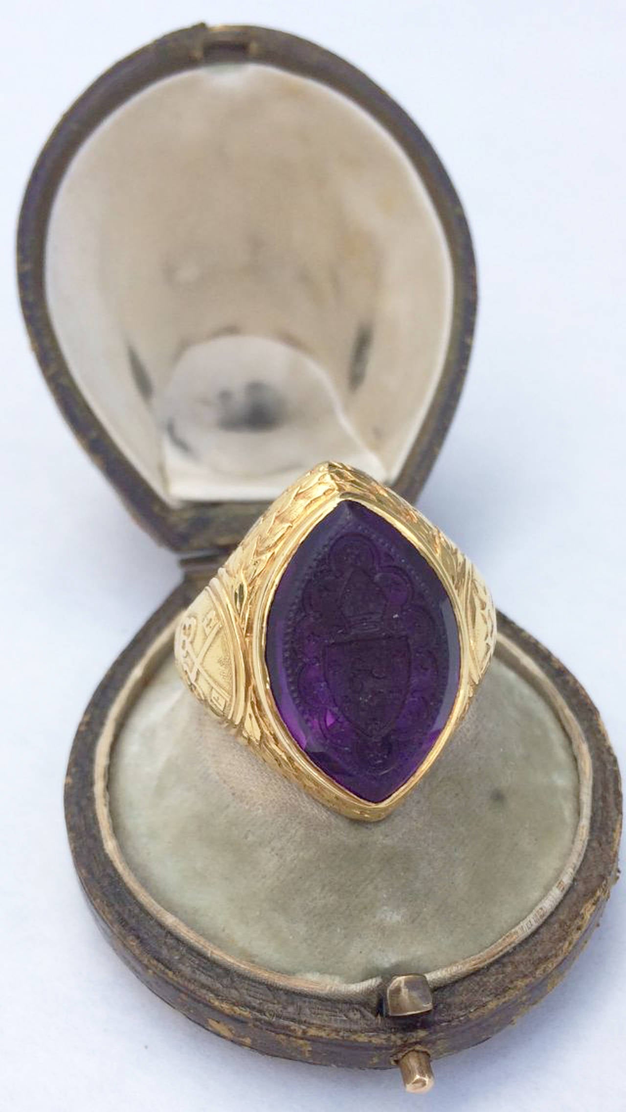 A fine and rare Victorian period Bishop's ring. Signed 18ct yellow gold item signed for T & J Bragg jewelers, Birmingham England circa1850. Exquisitely hand chased gold setting with a lush hand carved amethyst bezel set center. Rare item shows very