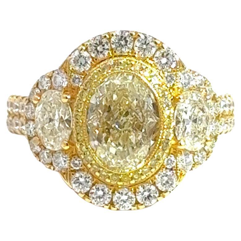 18K Yellow Gold Three-Stone Oval Diamond Ring with Fancy Yellow Accents