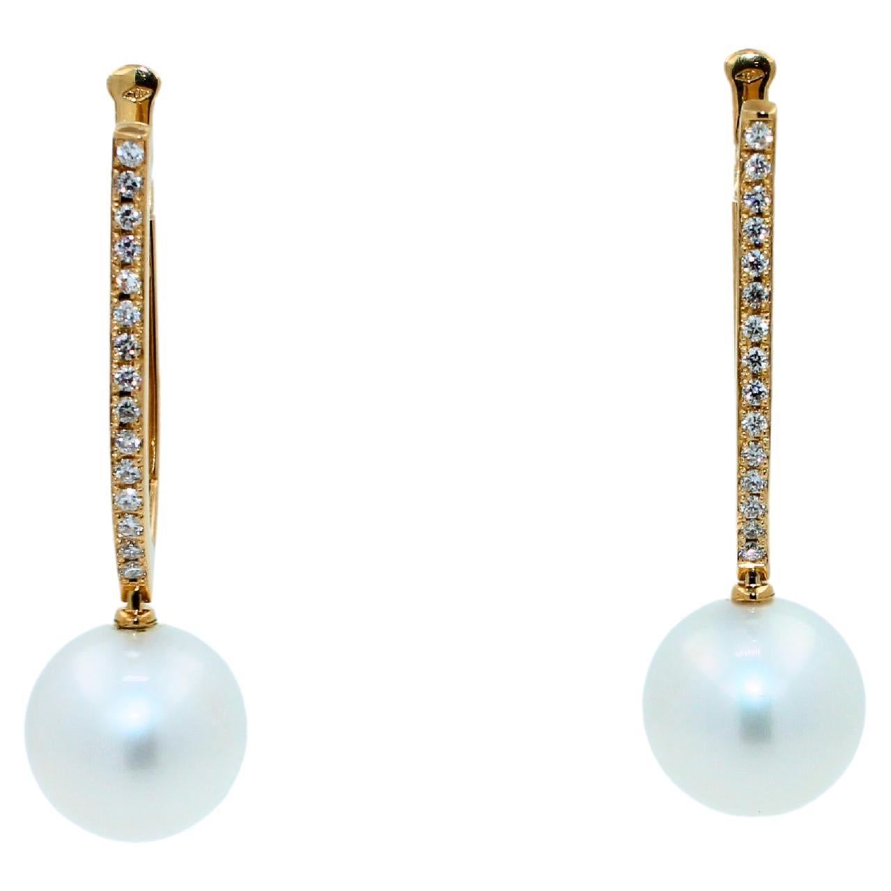 White AAA Quality South Sea Pearls
Size 14MM Diameter
Striking Silvery Hue with Light Blue Iridescent  Tones
Very Reflective Surface - Almost Mirror-Like 
1.50 cts Diamonds VVS Quality
14.35 Grams Total Weight
5 cm length of full earrings
18K Yellow