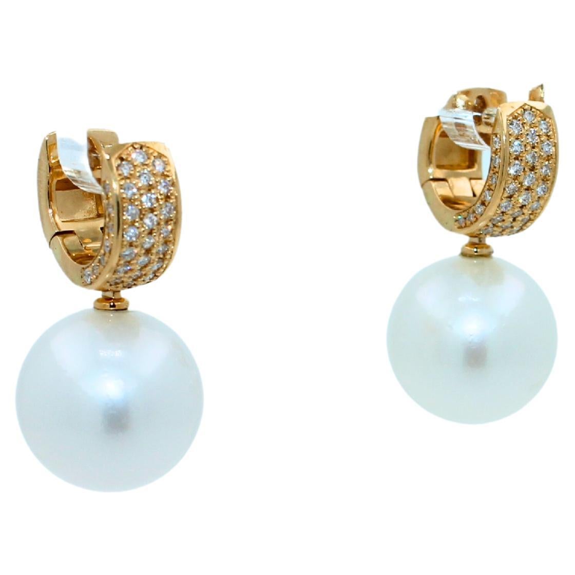 White AAA Quality South Sea Pearls
Striking Silvery Hue with Light Blue Iridescent  Tones
Very Reflective Surface - Almost Mirror-Like 
Full Classic Sphere Shapes
15 MM Diameter Size
18.4 Grams Total Weight
0.70 cts Diamonds VVS Quality
2.75 CM Full
