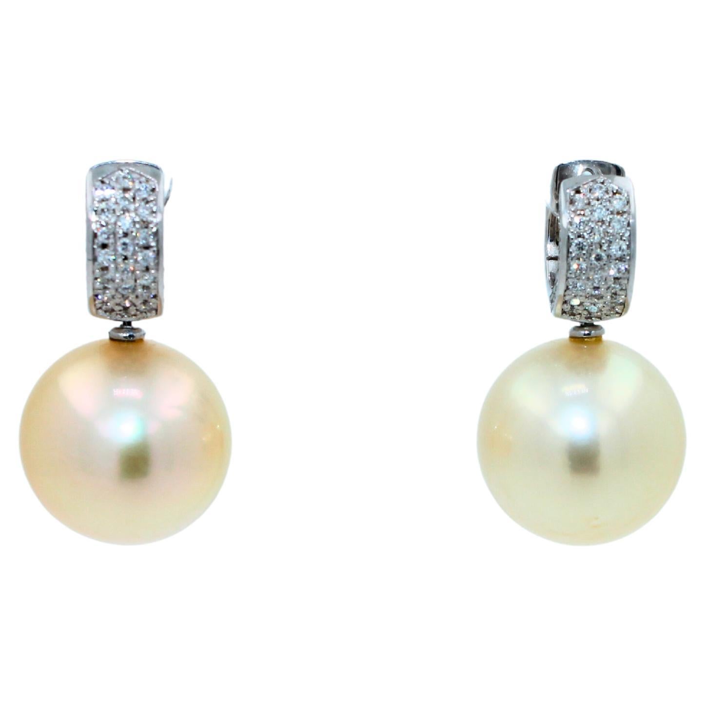 Natural Light Golden Warm AAA Quality South Sea Pearls
Very Reflective Surface - Almost Mirror-Like 
Full Classic Sphere Shapes
16-17 MM Diameter Size
22.65 Grams Total Weight
0.70 cts Diamonds VVS Quality
3.2 CM Full Length of Earrings
18 Karat
