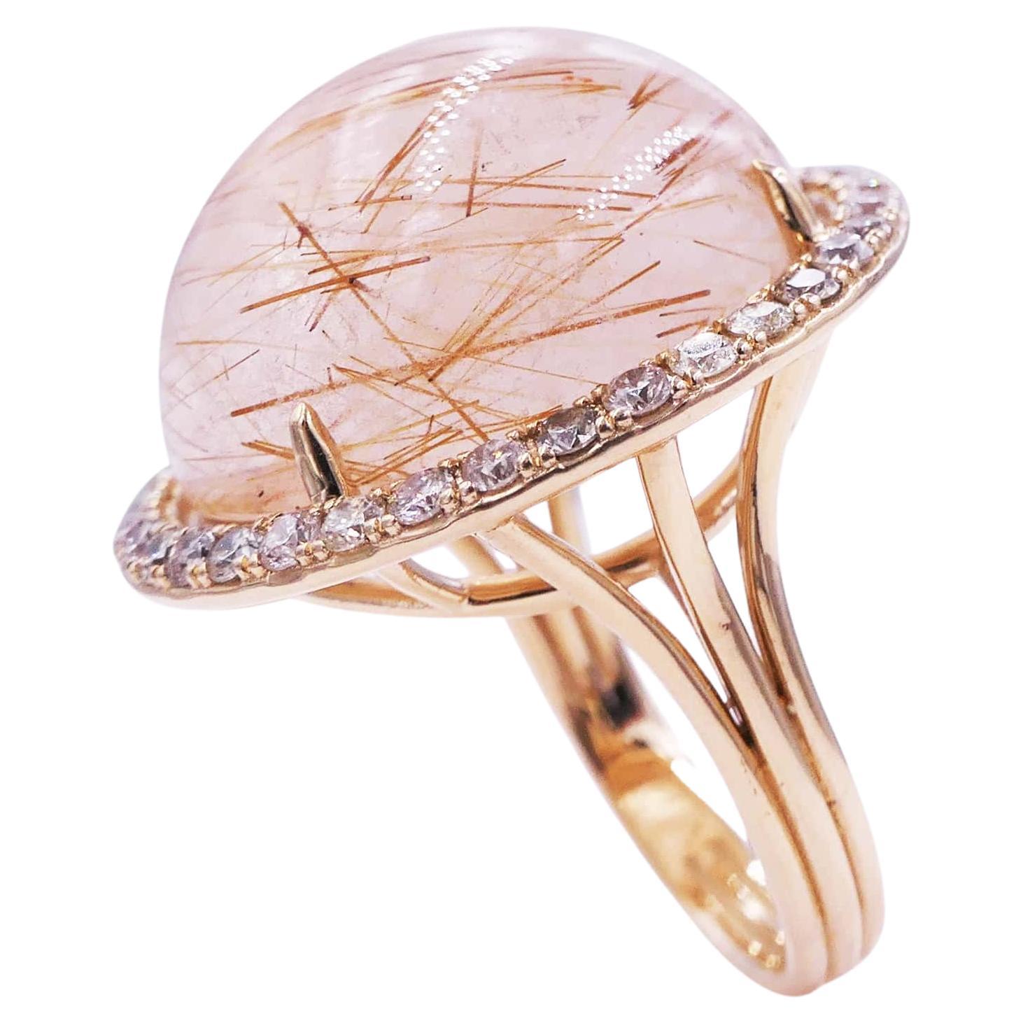 Rutilated Pink Quartz Round Cabochon Halo Diamonds 14 Karat Yellow Gold Ring
14 Karat Yellow Gold
Rutilated Quartz
0.50 cts Diamonds
Size 7, Resizable upon request 

Important Information:
Please note that this item will take 2-4 weeks to deliver -