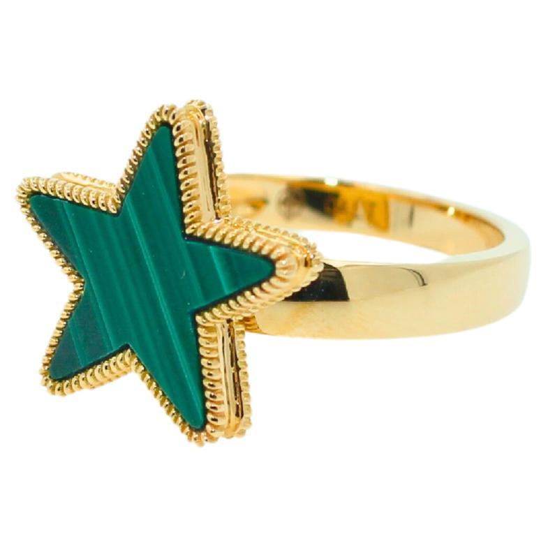 Green Malachite Star Galaxy Celestial Constellation Zodiac 18K Yellow  Gold Ring
18K Yellow Gold
Green Malachite Cabochon Gemstone in a handcut, unique Star Shape 
Ring Size 7 - 
These are our own trademarked design with special gemstone cutting +