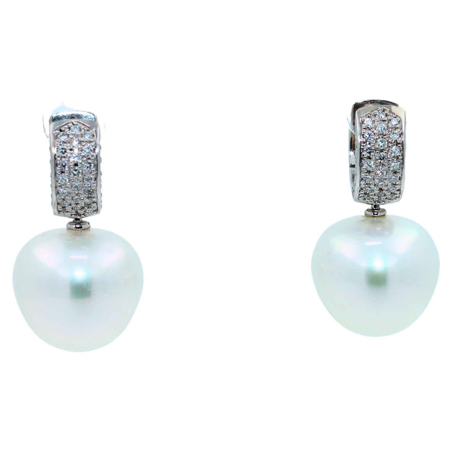 White AAA Quality South Sea Pearls
Striking Silvery Hue with Light Blue Iridescent  Tones
Very Reflective Surface - Almost Mirror-Like 
Special Rare Shapes - Unique Cushion Apple Forms
20 Grams Total Weight
0.70 cts Diamonds VVS Quality
3 CM Full