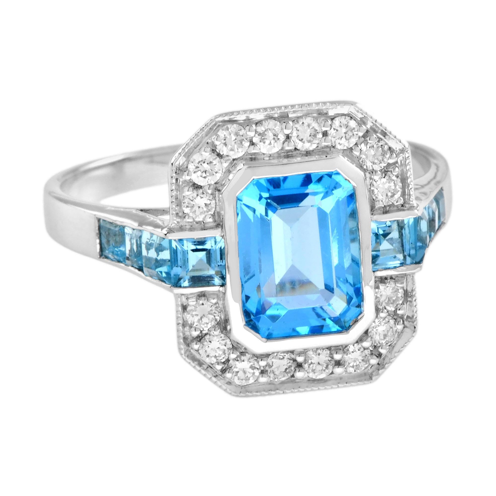 Une magnifique topaze bleue taillée en émeraude est présentée dans un style Art déco classique. La glorieuse pierre précieuse rayonne à l'intérieur d'un halo étincelant de diamants ronds blancs de taille brillant, menant à une topaze bleue suisse de