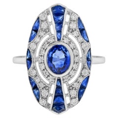 Anello con zaffiro blu e diamante di forma ovale in stile Art Deco in oro bianco 18 carati