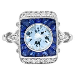 Bague en or blanc de style vintage avec aigue-marine bleue ronde, saphir bleu et diamant