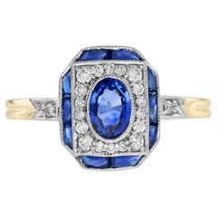 Anello in oro bicolore 14 carati con zaffiro blu e diamante di forma ovale in stile Art Deco