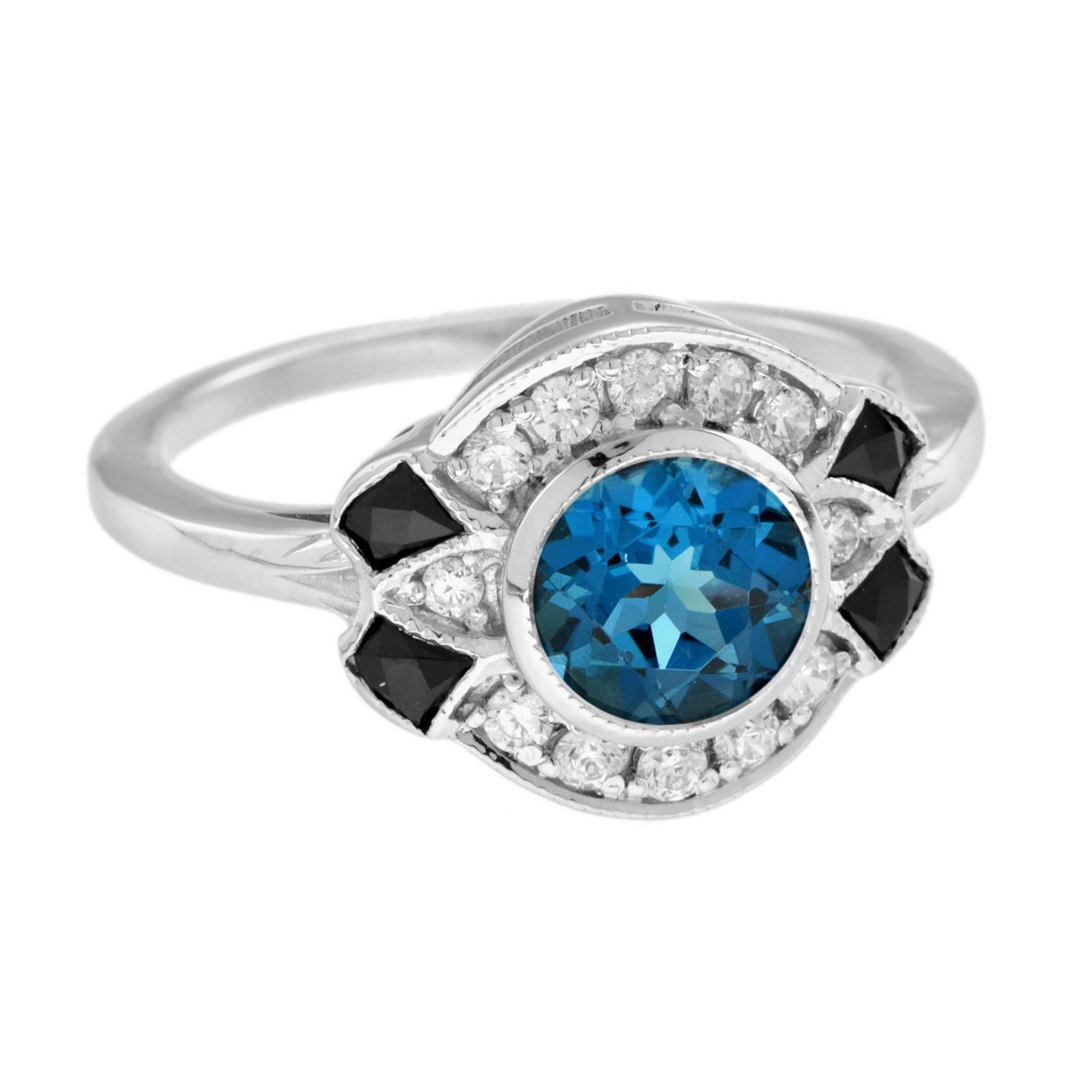 Cette bague contemporaine fantaisiste d'inspiration Art déco présente une opulente topaze bleue de Londres ovale de 1,25 carat d'un bleu profond, entourée de diamants ronds étincelants et d'onyx. Cette pièce charmante est une parure idéale pour