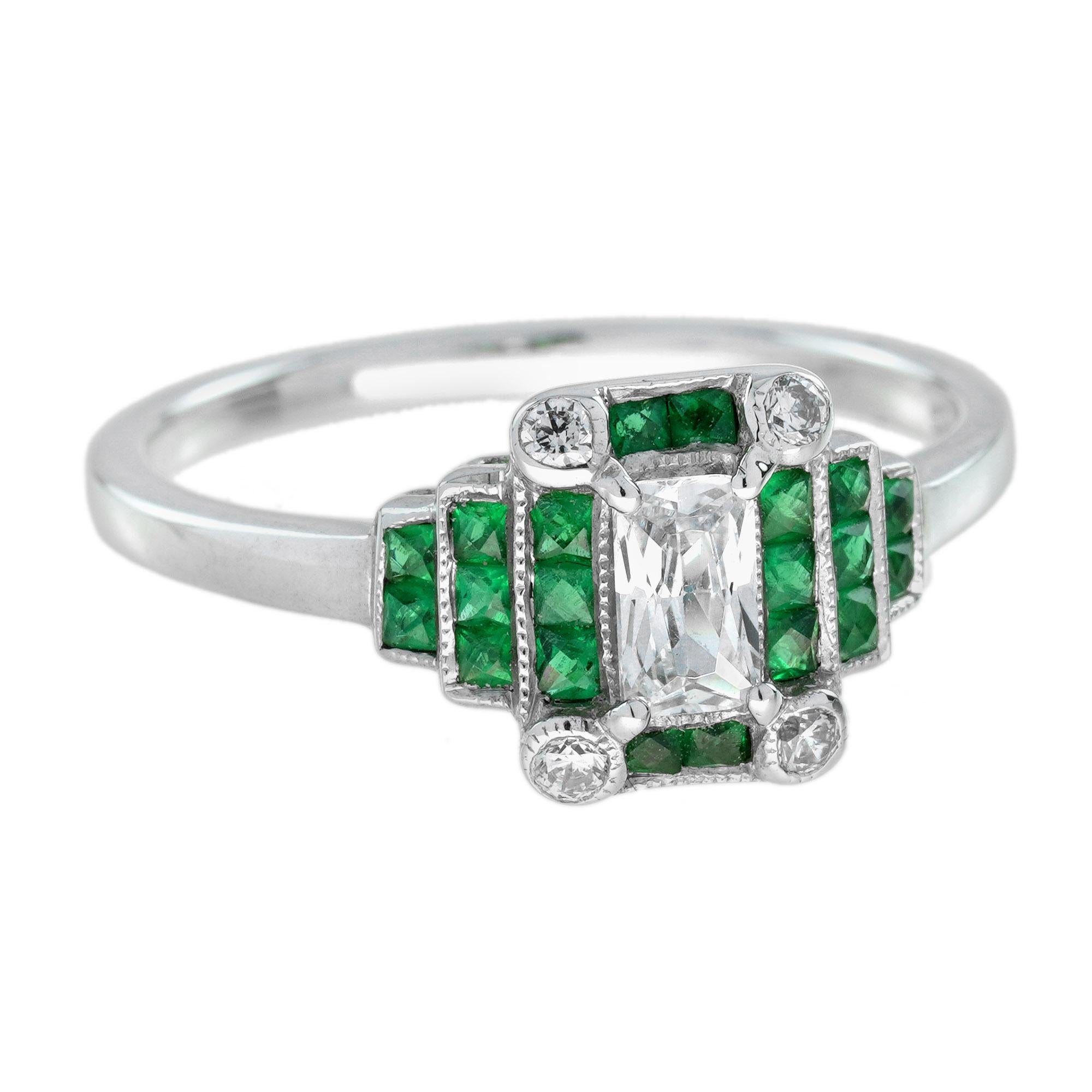 Cette splendide bague d'inspiration Art déco scintille en son centre d'un diamant radiant blanc de 0,22 carat, soutenu par des émeraudes de taille française, d'un poids total d'environ 1,34 carat, et par quatre diamants ronds à ses angles. Fabriqué