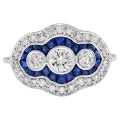 Anillo de oro blanco con halo de tres piedras, diamante redondo y zafiro azul, estilo Art Déco