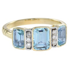 Anello a tre pietre in oro giallo 14 carati con topazio blu e diamanti in stile Art Deco