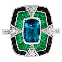 Topacio azul de Londres en forma de cojín y diamante esmeralda de ónice Anillo Art Decó de oro blanco