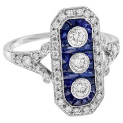 Anello con diamanti e zaffiri blu con tre pietre in stile Art Deco in oro bianco 14K