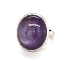 Mid-Century Oversized Purple Star Sapphire Ring, 18K White Gold, circa 1950s."