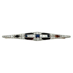 Art Deco Platinum 0.3ct Sapphire, Onyx and 1.5ct Diamond Bar Pin, Circa 1920s