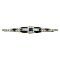 Art Deco Platinum 0.3ct Sapphire, Onyx and 1.5ct Diamond Bar Pin, Circa 1920s