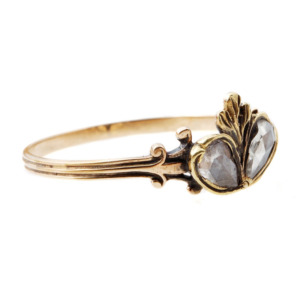Georgian Era Twin Diamond Heart Ring with Flame Detail in 14k Gold. Import hallmark for importation to the Netherlands around 1853.

Size 7.75 , sizable.