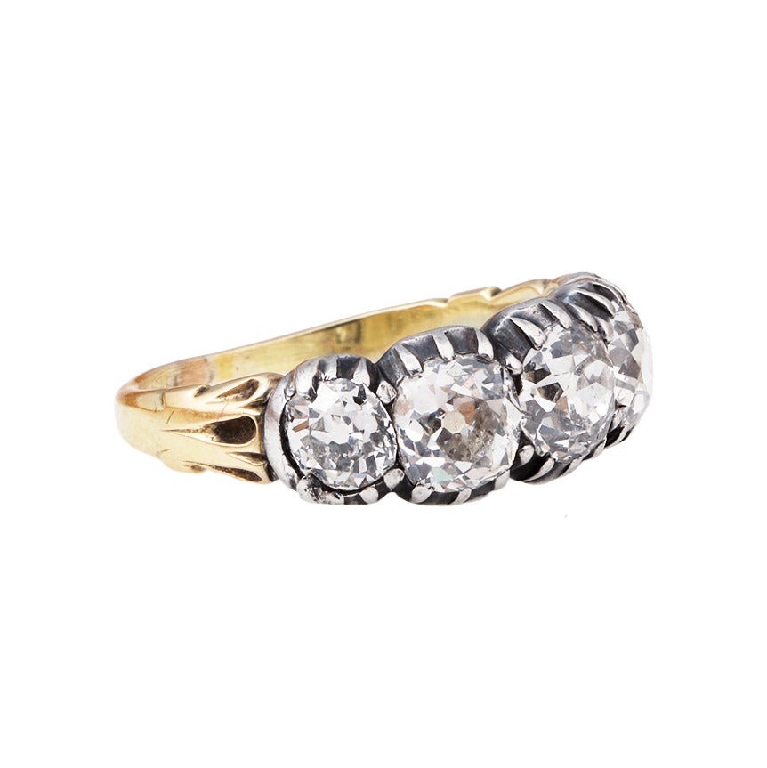 Old mine cut diamond half hoop ring. The diamonds are set in an open back cut away settings on an 18k gold shank.  English in origin. Large in scale and quite wearable. 

Size 7 , can be sized.