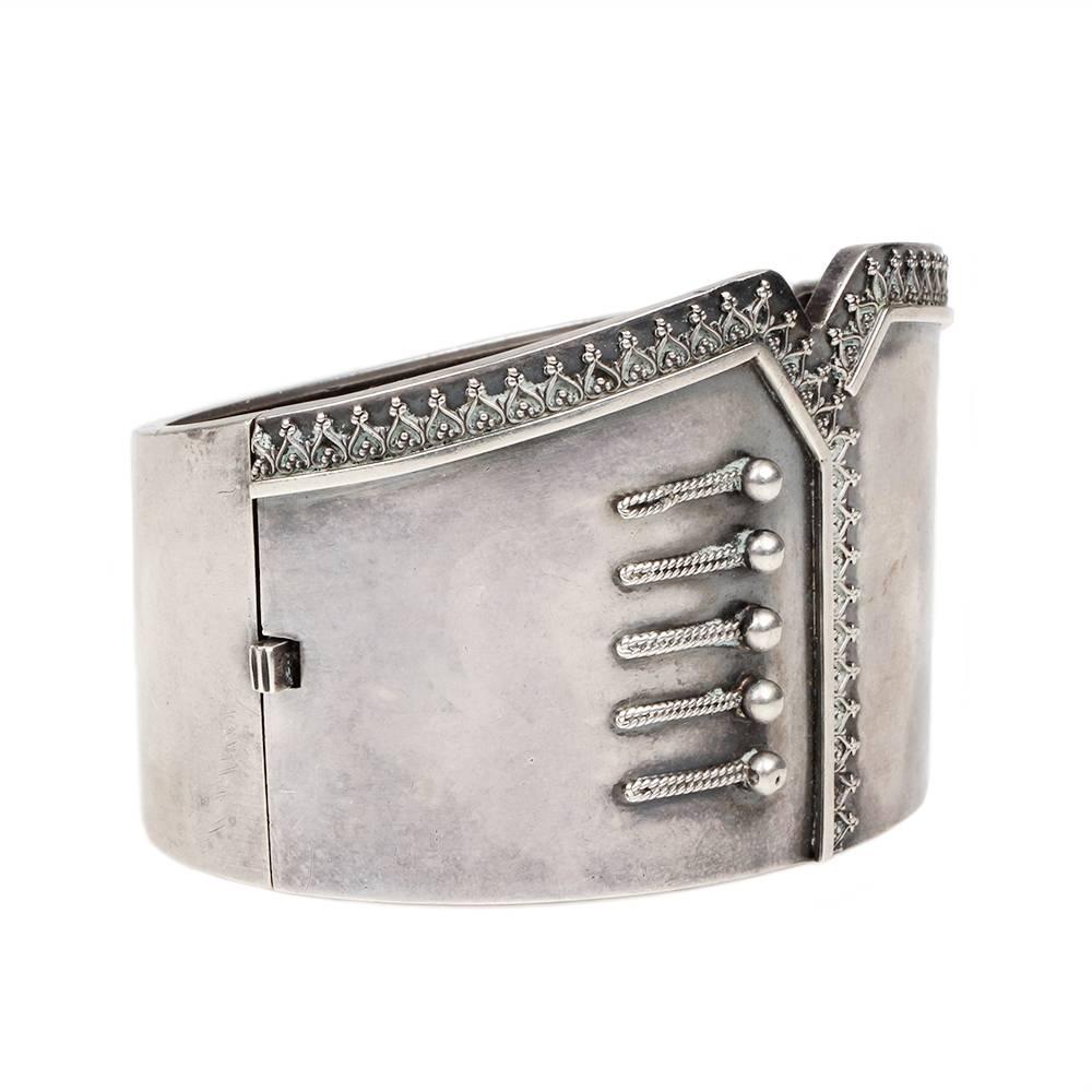 Victorian Sterling Silver Corset Bangle, Circa 1880's, English in Origin.  We have had many English Aesthetic movement sterling bangles, but we rarely come across the unusual corset design.  Especially done with such simplicity.  The Victorians