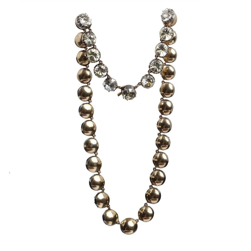 Georgian era white paste rivière necklace. Round paste stones set in 15k gold. Lays beautifully on the neck. Circa 1810. English in Origin.

Push button clasp. 15