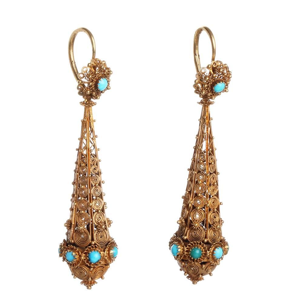 Georgian cannetille day and night torpedo earrings. In gold with turquoise stones. Dramatic look and light in weight. Circa 1830, Austrian in Origin.  

Back to front style earrings. 2.5