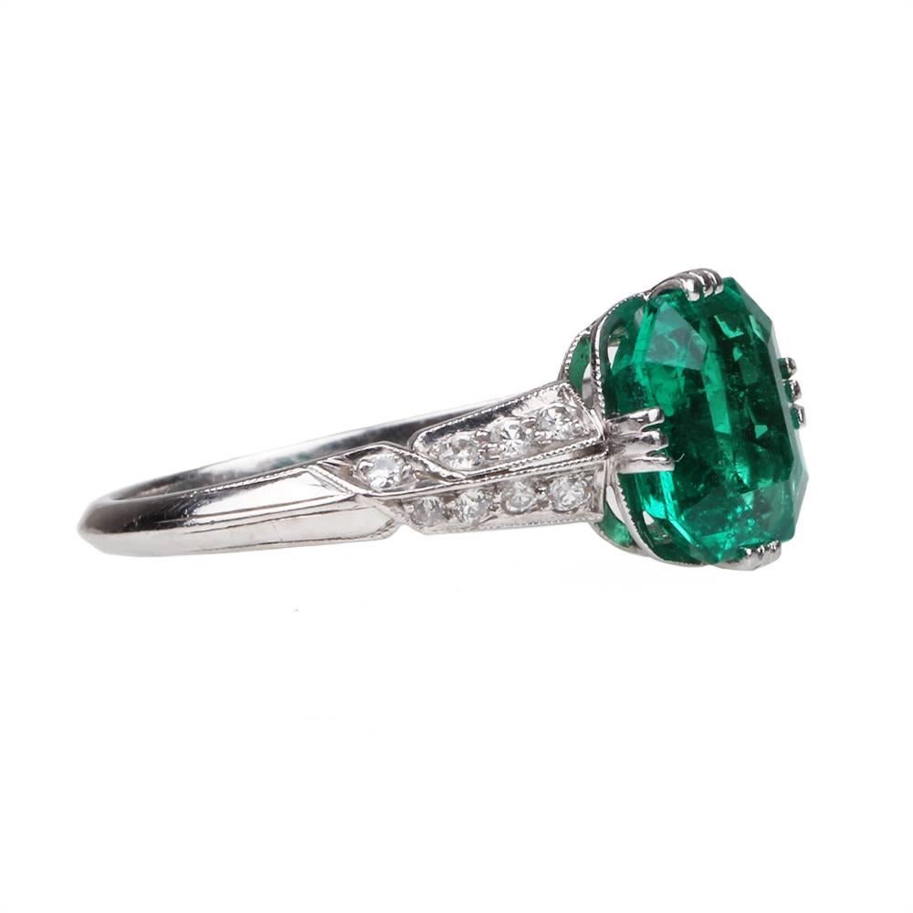 Art Deco Tiffany & Co. emerald and diamond ring, in platinum setting. Approximately 1.5 carat Columbian cushion cut emerald with insignificant to minor oil treatment, AGL certified. Lovely bright deep green color. Exceptional  Tiffany's