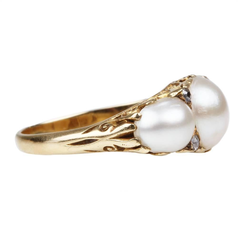 Victorian 3 stone natural pearl and diamond ring. English in origin. Circa 1880.

Size 6.5 , can be resized. 