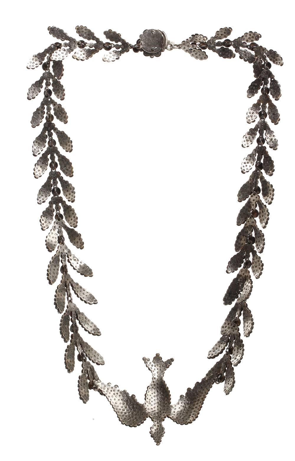 Early 19th century cut steel necklace. Dove and olive branch motif. Cut steel push clasp. Measuring a generous 16.5