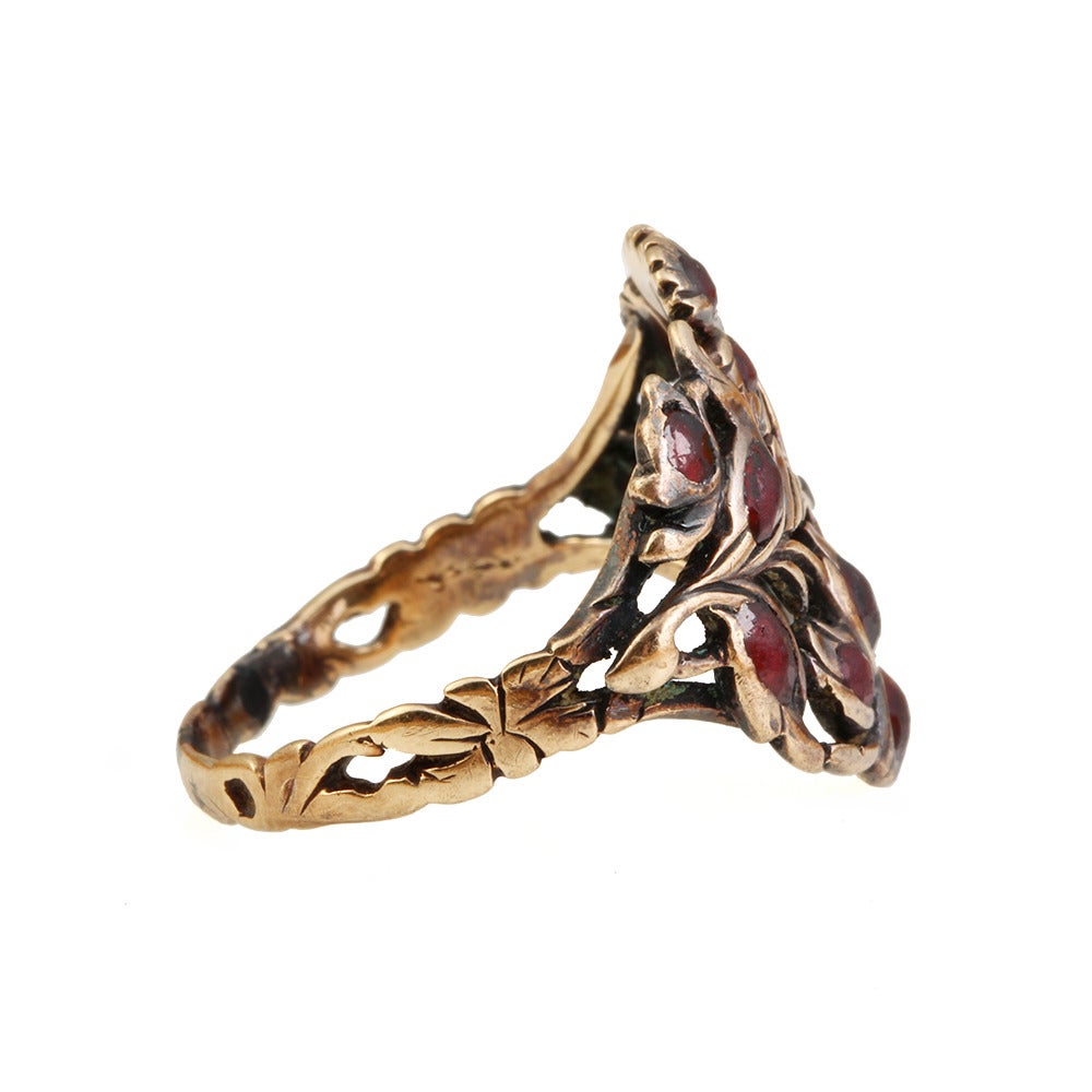 Georgian garnet giardinetti ring in gold. Giardinetti meaning 
