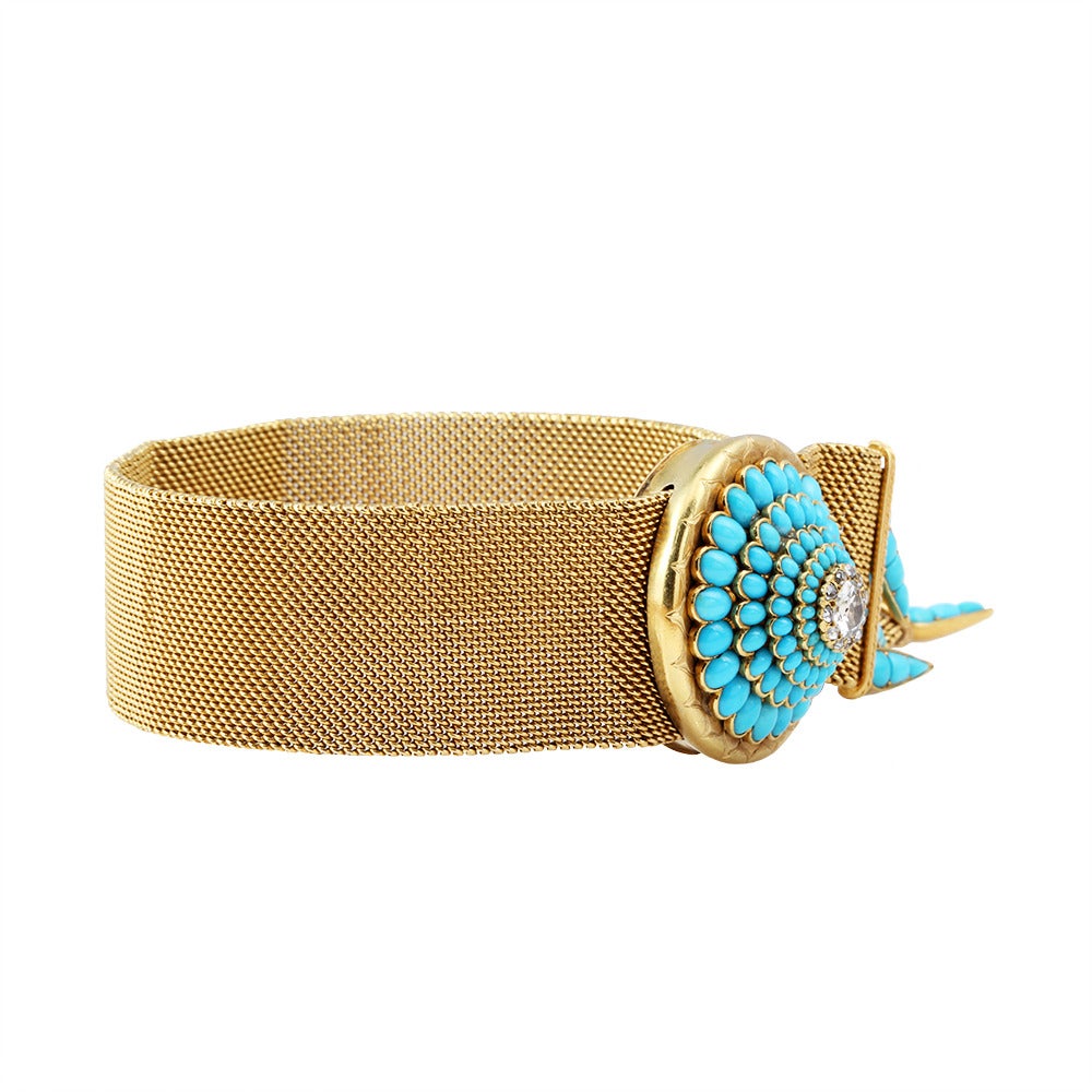 Victorian gold mesh bracelet with turquoise and diamond with turquoise tassels. Circa 1870.  English in origin in 18k carat gold. Slide mechanism adjusts for a varied fit. Old mine cut center stone surrounded by rose cut diamonds and oval turquoise